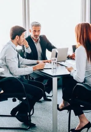 Business meeting in modern office setting.