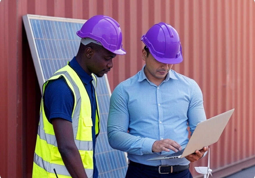 Two workers discussing end to end procurement project.